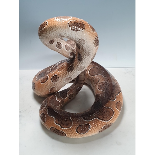 543 - An Italian large ceramic coiled Snake with brown painted details,15in