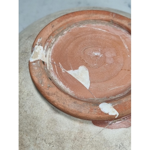 546 - An Islamic Nishapur 12th Century slip glaze pottery Bowl with Koranic inscription to interior, A/F, ... 