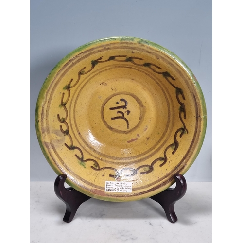 547 - An antique glazed pottery Bowl, Islamic Nishapur type in yellow and green glaze, A/F, 2 1/2 in H x 9... 