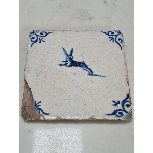 549 - A collection of nine antique delft Tiles, three depicting birds with coloured highlight decoration (... 