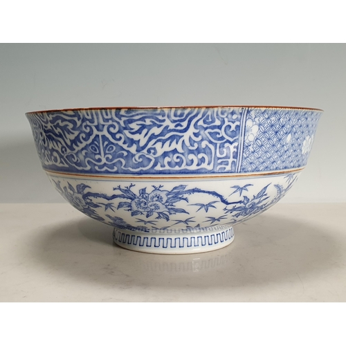 550 - An Oriental ceramic Bowl, the exterior with floral band rim and floral decorated panels, the interio... 