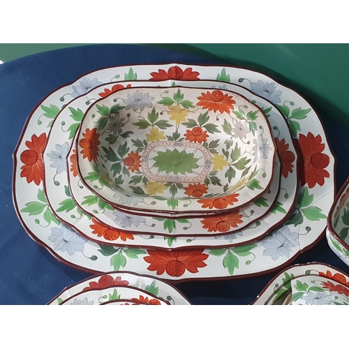 553 - A 19th Century creamware part Dinner Service with over-glaze painted floral design in predominantly ... 