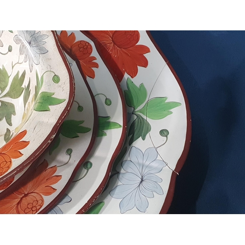 553 - A 19th Century creamware part Dinner Service with over-glaze painted floral design in predominantly ... 