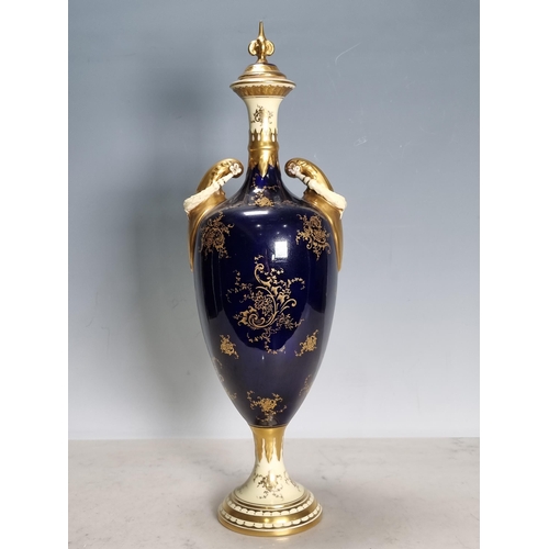 556 - A Coalport baluster Vase and Cover with two handles, having swag decoration, painted scene of Kilchu... 