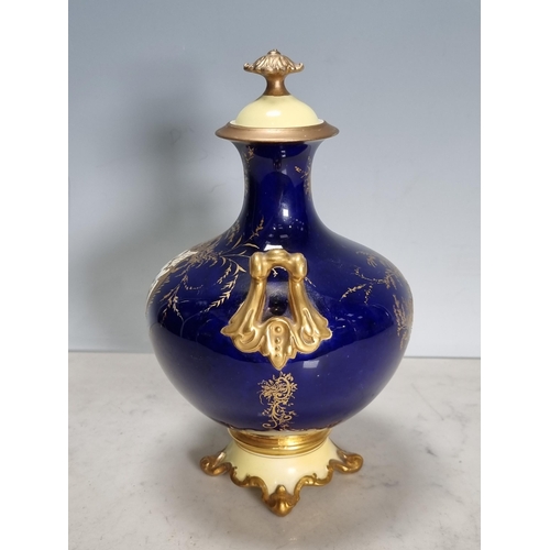 558 - A Coalport two-handled baluster Vase, painted bridge in a landscape, richly gilt, lid and feet resto... 