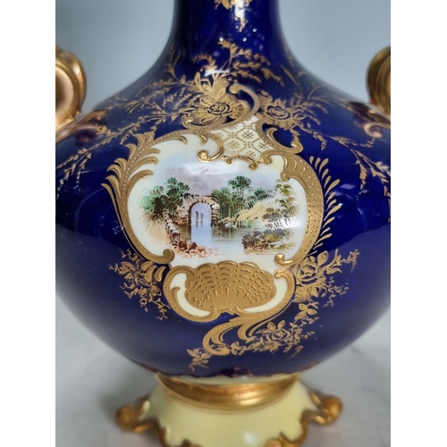 558 - A Coalport two-handled baluster Vase, painted bridge in a landscape, richly gilt, lid and feet resto... 