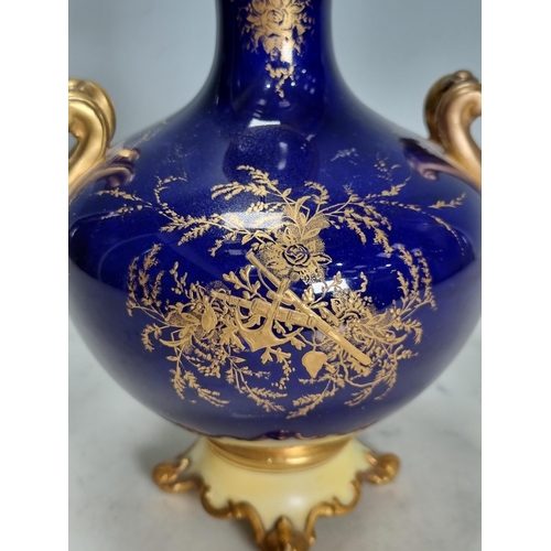 558 - A Coalport two-handled baluster Vase, painted bridge in a landscape, richly gilt, lid and feet resto... 