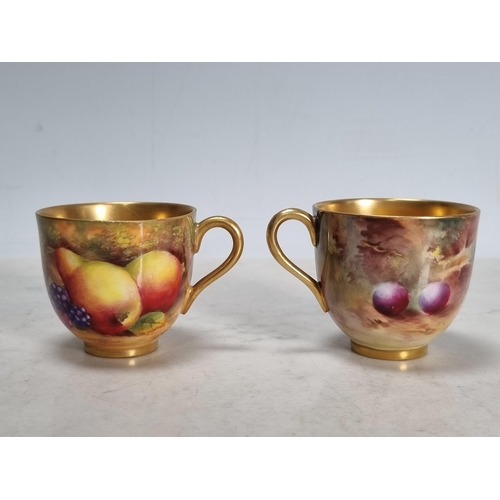 561 - Two Royal Worcester fruit painted Coffee Cups and Saucers, peaches, apples, cherries and berries, si... 