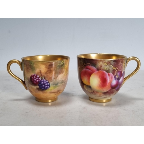 561 - Two Royal Worcester fruit painted Coffee Cups and Saucers, peaches, apples, cherries and berries, si... 