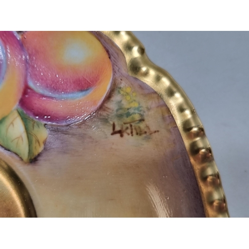 566 - A Royal Worcester fruit painted Plate, peaches and grapes on an autumnal ground, signed 'Freeman', 8... 