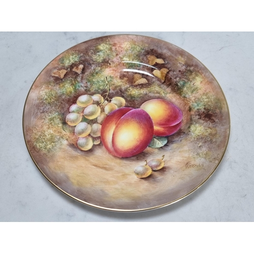 566 - A Royal Worcester fruit painted Plate, peaches and grapes on an autumnal ground, signed 'Freeman', 8... 