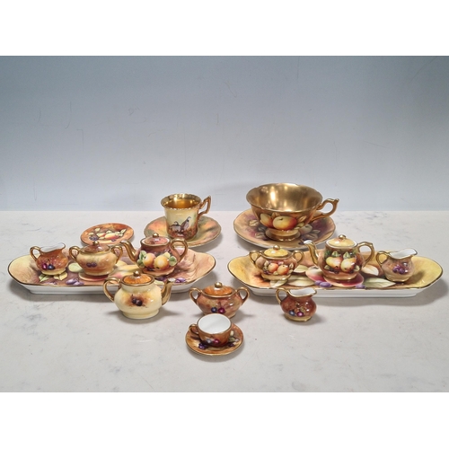 576 - A collection of miniature Coalport fruit painted Tea Pots, Cream Jugs, Sugar Bowls, on two trays, pa... 