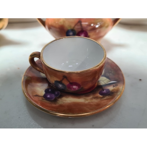 576 - A collection of miniature Coalport fruit painted Tea Pots, Cream Jugs, Sugar Bowls, on two trays, pa... 