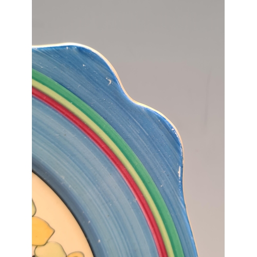 582 - A Clarice Cliff leda-shaped Plate 'Idyll', shaped rim, blue and green line decoration, 10in D