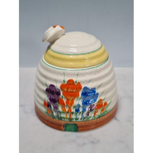 583 - A Clarice Cliff lidded Honey Pot, Teapot, small Trinket Dish and Jam Pot, (missing lid), all 'Crocus... 