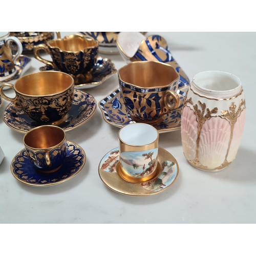 586 - A collection of Coalport miniature Coffee Pots, Saucers, Dishes, Bowls and Vases, chiefly blue and g... 