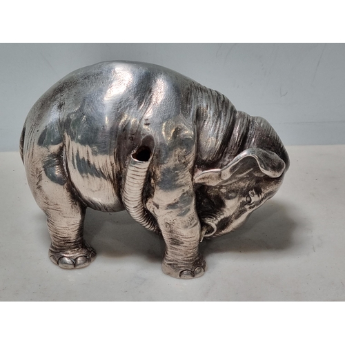 59 - A white metal Pen Holder in the form of an elephant, 4in