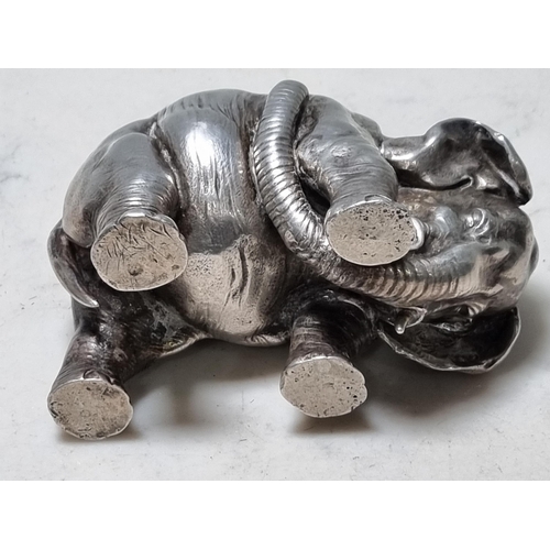 59 - A white metal Pen Holder in the form of an elephant, 4in