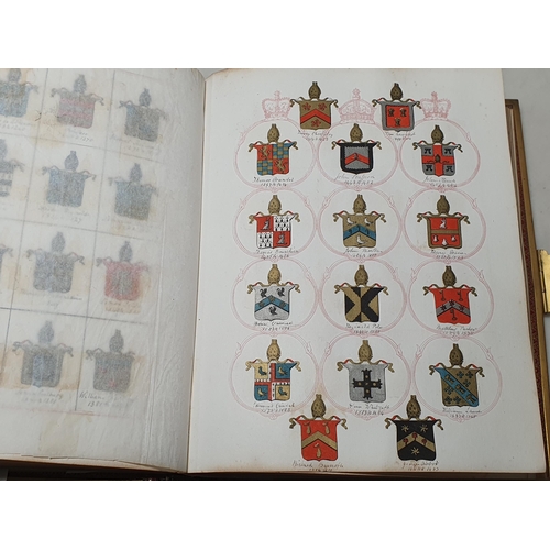 635 - Two gilt tooled leather Albums containing a collection of Coats of Arms.