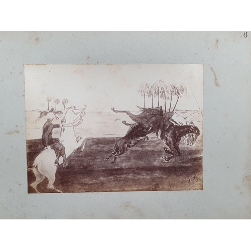 641 - An Album containing a collection of eleven pen and wash Paintings of Pig Hunting in Imperial India.