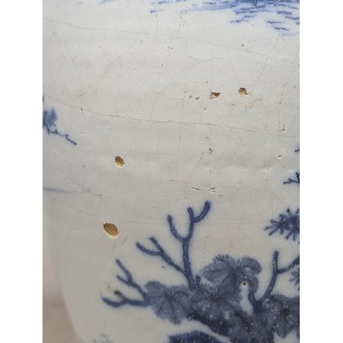 548 - A 17th Century delftware Meiping type Vase, in blue and white glaze, with Oriental landscape with fi... 