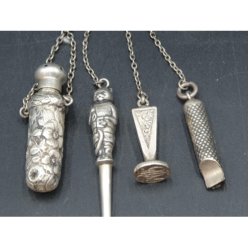 70 - A sterling silver Scarf Clip with leafage engraving, and a white metal Chatelaine with  whistle, sea... 