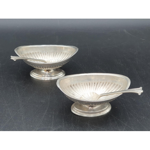 71 - A pair of Victorian silver oval semi-fluted Salts and Spoons, London 1889, spoons, Sheffield 1882