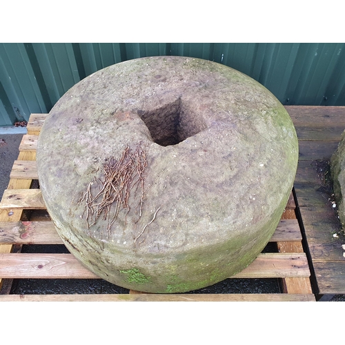 710 - A large mill/press stone with square hole to centre, approx 3ft 2in Diam