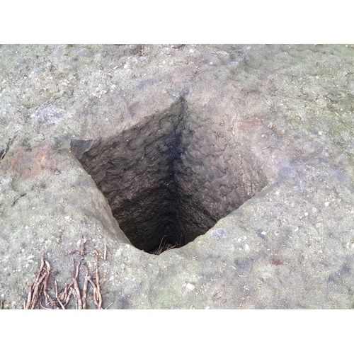 710 - A large mill/press stone with square hole to centre, approx 3ft 2in Diam