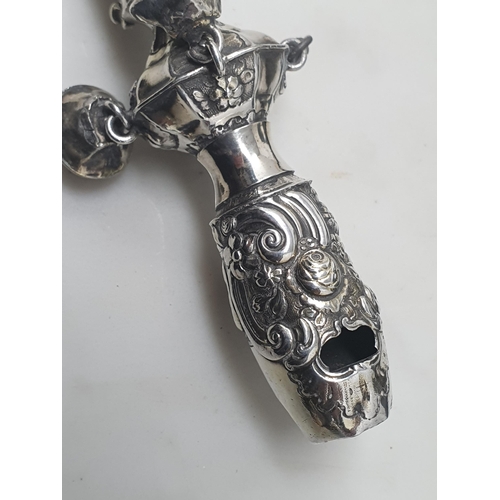 72 - A silver Rattle with floral embossing and two bells, others missing, engraved initials C.D