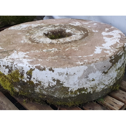 721 - A large circular weathered Mill/Press Stone with square cut hole to centre, approx 3ft 1in Diam