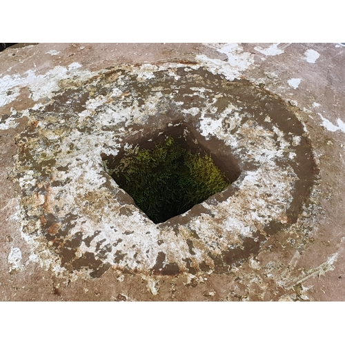 721 - A large circular weathered Mill/Press Stone with square cut hole to centre, approx 3ft 1in Diam