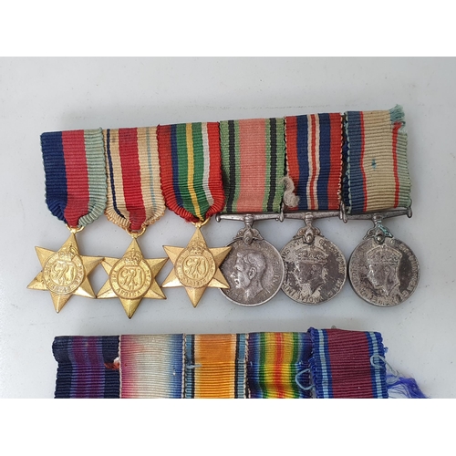 767 - Three Miniature Groups of Medals including; WWI MBE, Distinguished Service Medal, 1914-15 Star, War ... 