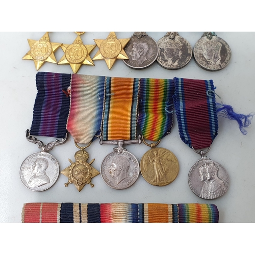 767 - Three Miniature Groups of Medals including; WWI MBE, Distinguished Service Medal, 1914-15 Star, War ... 