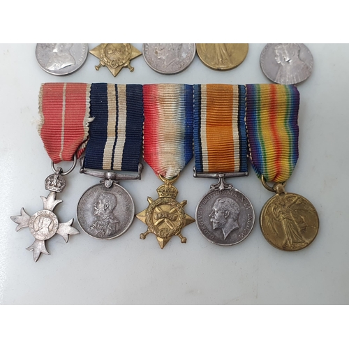 767 - Three Miniature Groups of Medals including; WWI MBE, Distinguished Service Medal, 1914-15 Star, War ... 