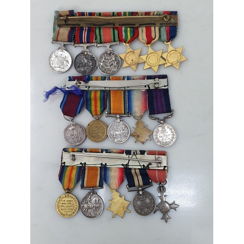 767 - Three Miniature Groups of Medals including; WWI MBE, Distinguished Service Medal, 1914-15 Star, War ... 