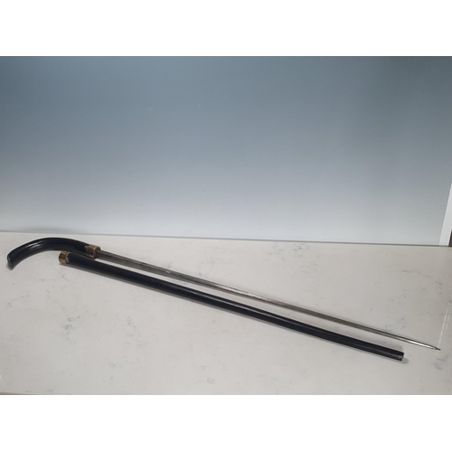 791 - An antique ebonised Sword Stick with brass collar by Mole, Birmingham 2ft 11in L overall