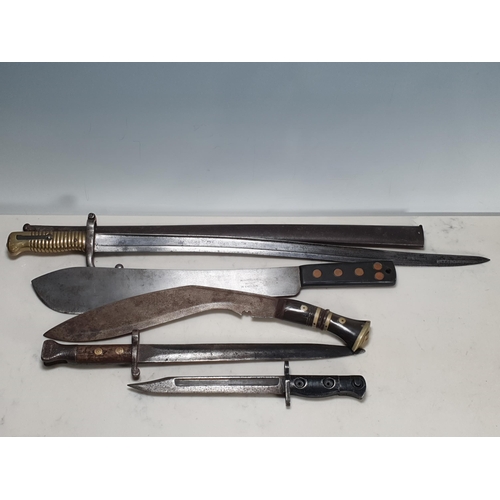 792 - A British WWII Machete, Lee-Metford Bayonet, L1A3 Bayonet, an 1874 Chassepot Bayonet and scabbard an... 