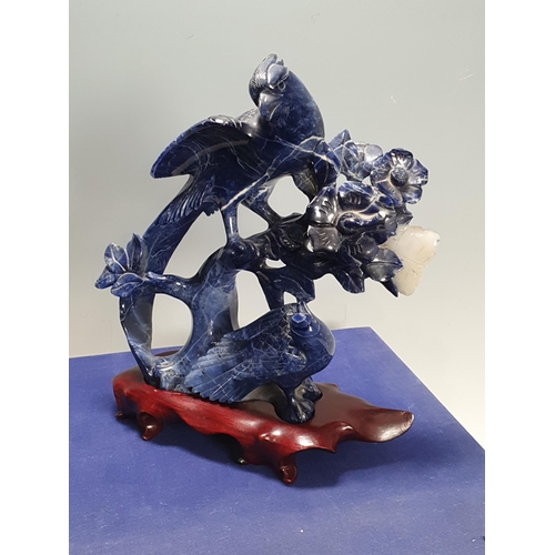 822 - A Chinese Lapis Lazuli carved Figure of a pair of birds perched on a flowering branch with a butterf... 