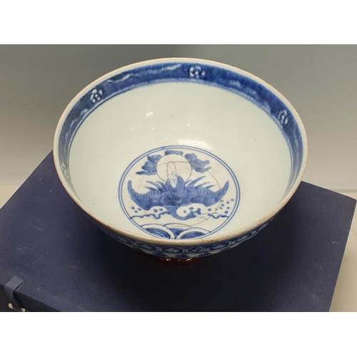 823 - A Japanese Arita blue and white Bowl in the Ming Style, 17th Century, depicting Shoulao to the centr... 