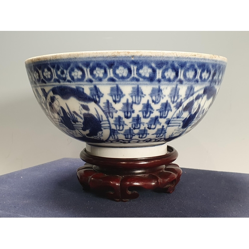 823 - A Japanese Arita blue and white Bowl in the Ming Style, 17th Century, depicting Shoulao to the centr... 