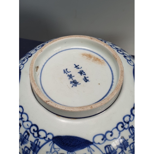 823 - A Japanese Arita blue and white Bowl in the Ming Style, 17th Century, depicting Shoulao to the centr... 