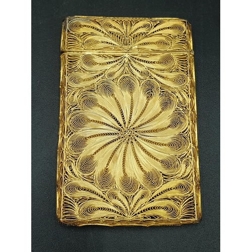 86 - A gilt filigree Card Case with swirl decoration, engraved initials, in case