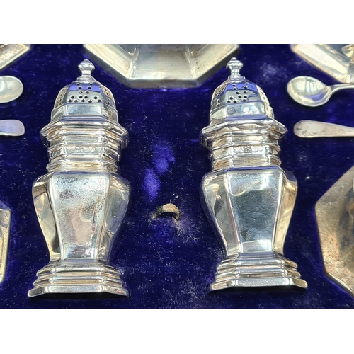 92 - An Edward VII silver seven piece Condiment Set of octagonal form, London 1907, Sheffield 1905, 360gm... 