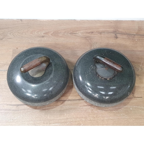 715 - A pair of granite Curling Stones, 10in diam