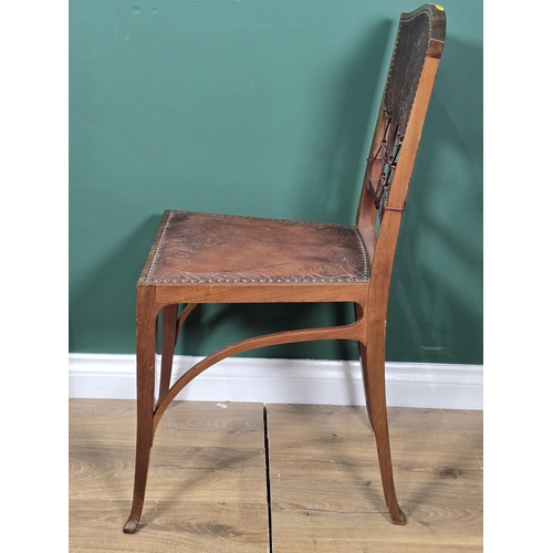 411 - An early 20th century Aesthetic Movement mahogany Hall Chair with peacock embossed leather back and ... 