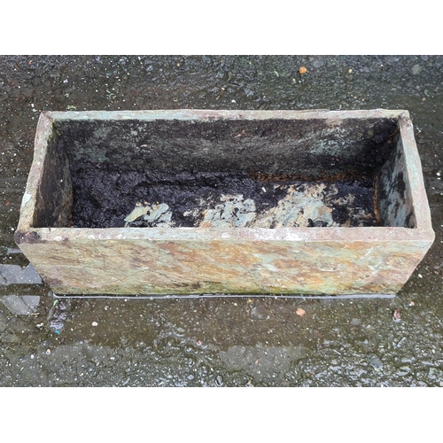 731 - A small Stone Trough and a cast iron Gutter Head