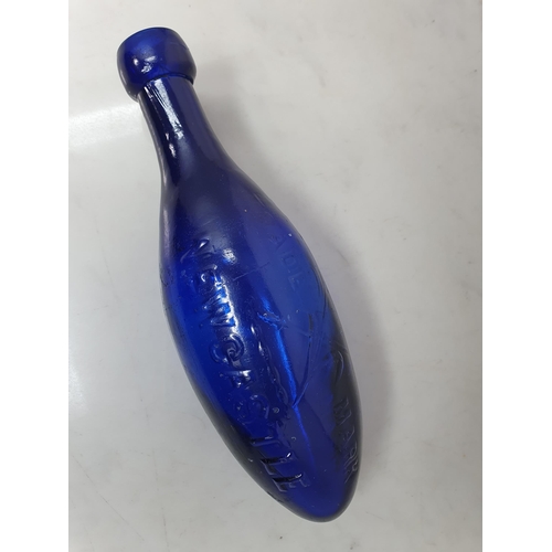 536 - A blue glass torpedo shape Fire Extinguisher by Glendenning Newcastle, 9in