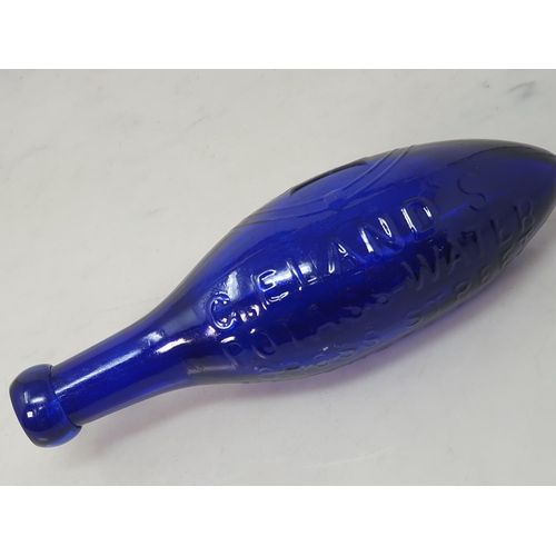 555 - A blue glass torpedo shape Fire Extinguisher by G Eland's Potass Water, Cross Street, Westgate Road,... 