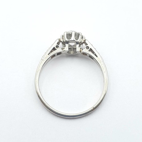 142 - A Diamond Ring, claw-set old-cut diamond in a rex collet with split tapered shoulders set small diam... 